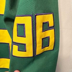 Green Jersey with Yellow and Purple Number 96